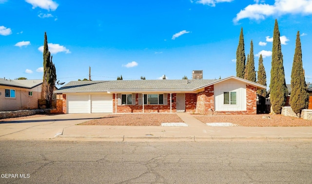 ranch-style house featuring a garage