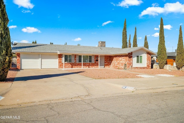 ranch-style home featuring a garage