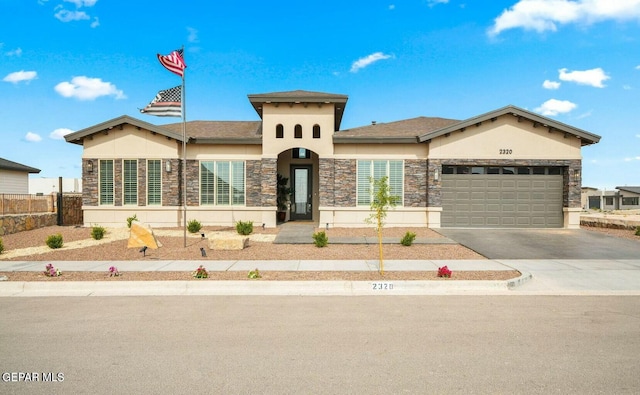 view of front of home with a garage