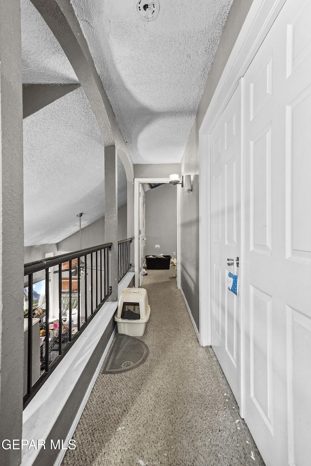 hallway featuring a textured ceiling