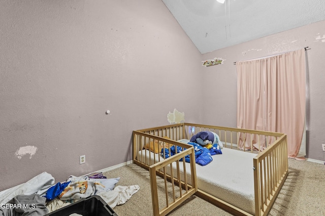 carpeted bedroom featuring vaulted ceiling