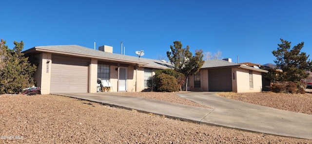 ranch-style home featuring a garage