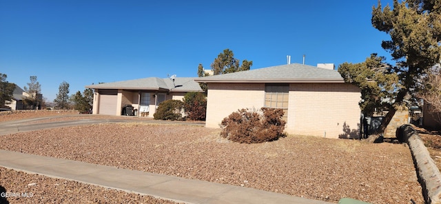 view of side of property with a garage