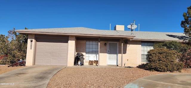 ranch-style home featuring a garage