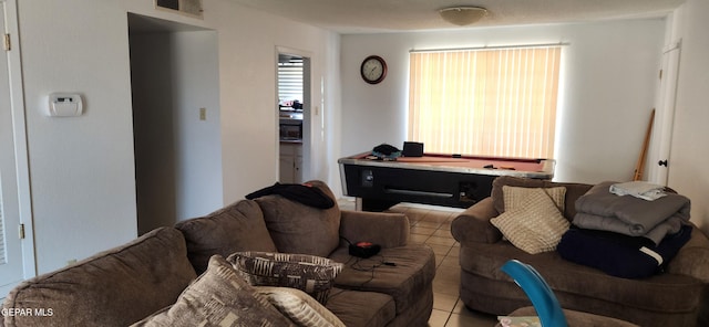 living room with light tile patterned floors