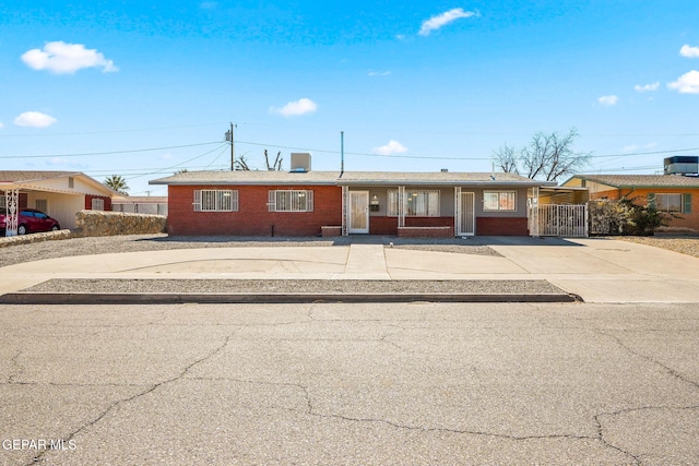 ranch-style home featuring central AC