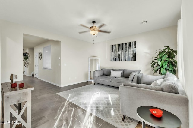 living room with hardwood / wood-style flooring and ceiling fan