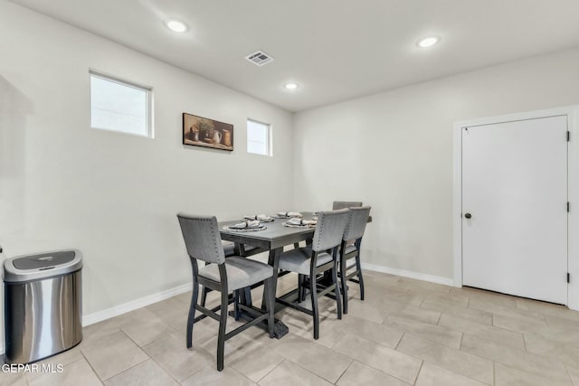 dining area with light tile patterned floors