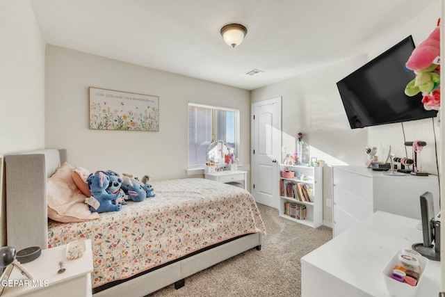 bedroom featuring light colored carpet