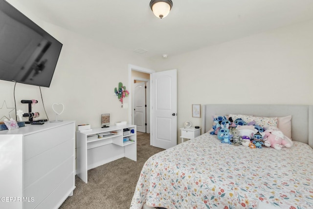 bedroom with dark colored carpet