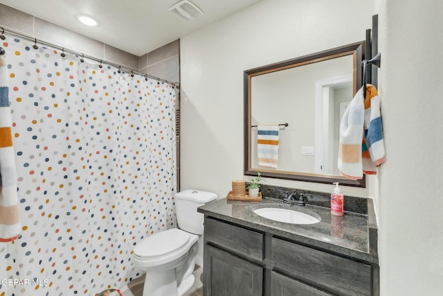 bathroom featuring vanity, a shower with curtain, and toilet