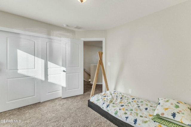 carpeted bedroom featuring a closet