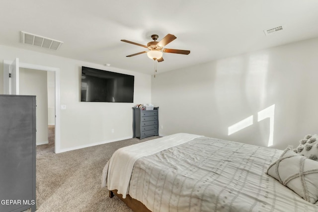 bedroom with ceiling fan and light carpet