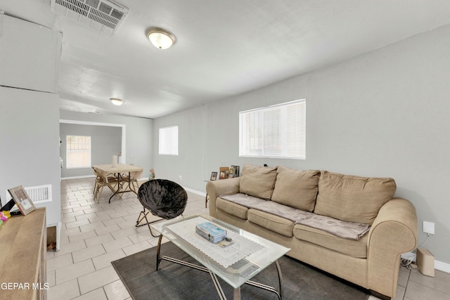 living room with light tile patterned floors