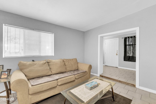 living room with tile patterned floors