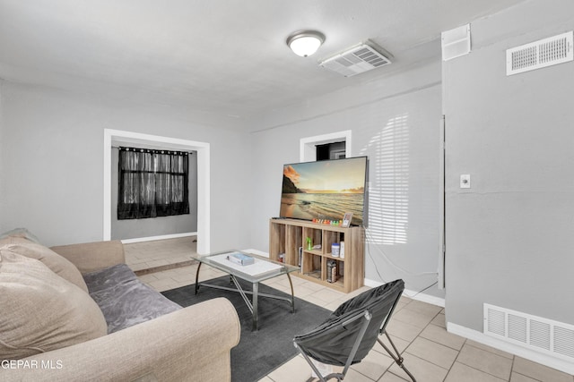 living room with light tile patterned floors