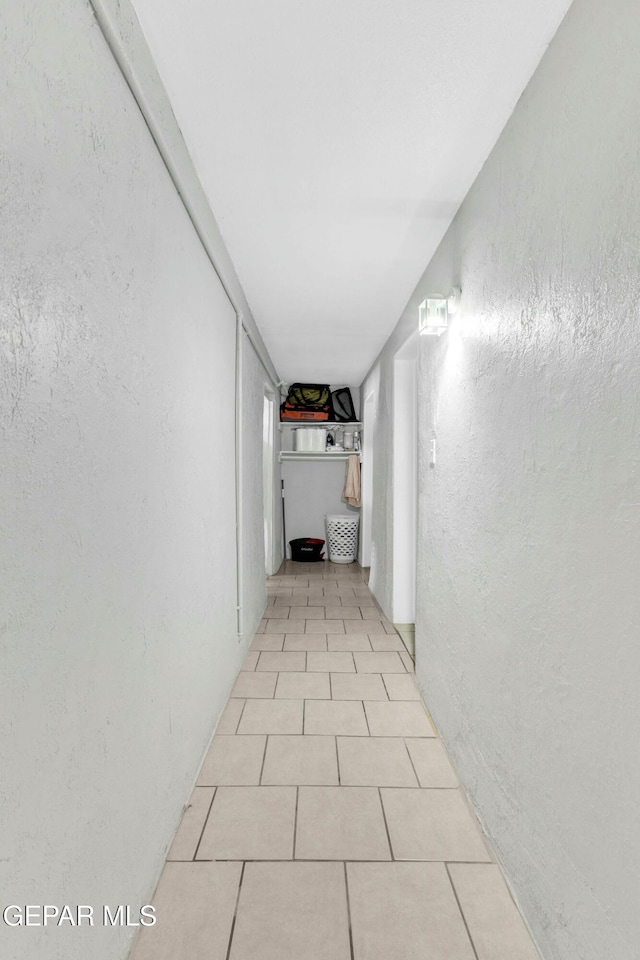 corridor with light tile patterned floors