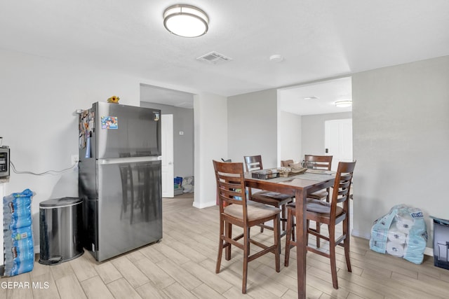 dining space featuring light hardwood / wood-style floors