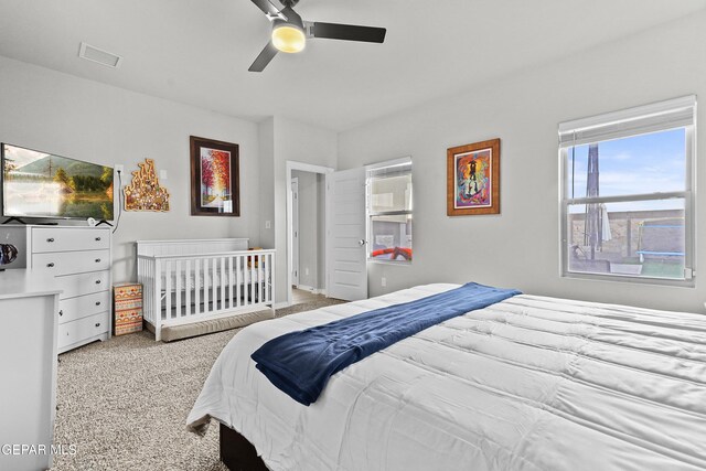 carpeted bedroom featuring ceiling fan