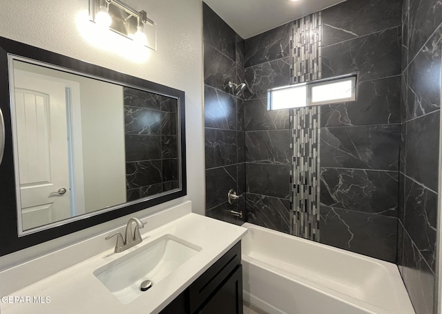 bathroom with vanity and tiled shower / bath combo