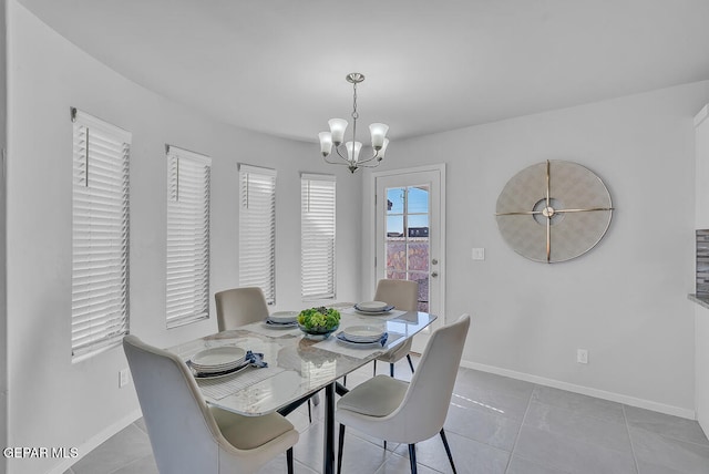 tiled dining area with a notable chandelier