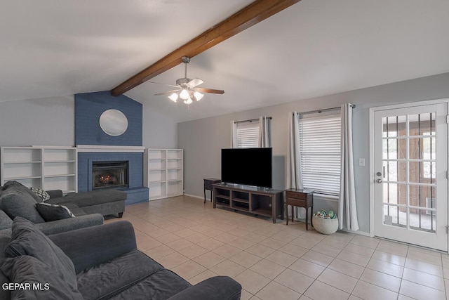 tiled living room with ceiling fan, a fireplace, and vaulted ceiling with beams