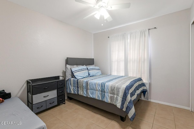 bedroom featuring ceiling fan and light tile patterned floors