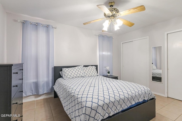 tiled bedroom with ceiling fan