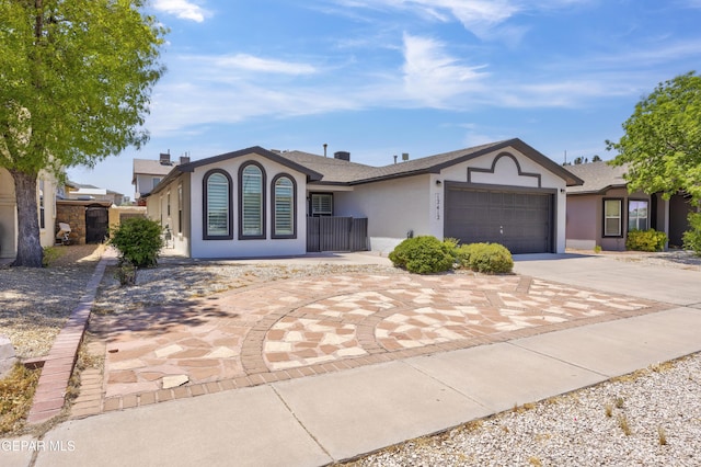 ranch-style house featuring a garage