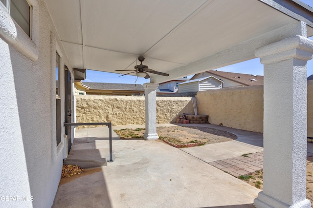 view of patio featuring ceiling fan