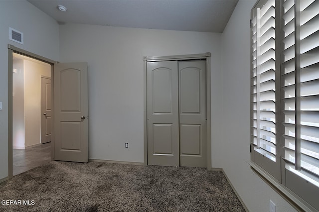 unfurnished bedroom featuring light colored carpet