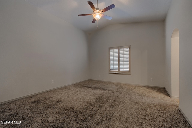 carpeted spare room with vaulted ceiling and ceiling fan