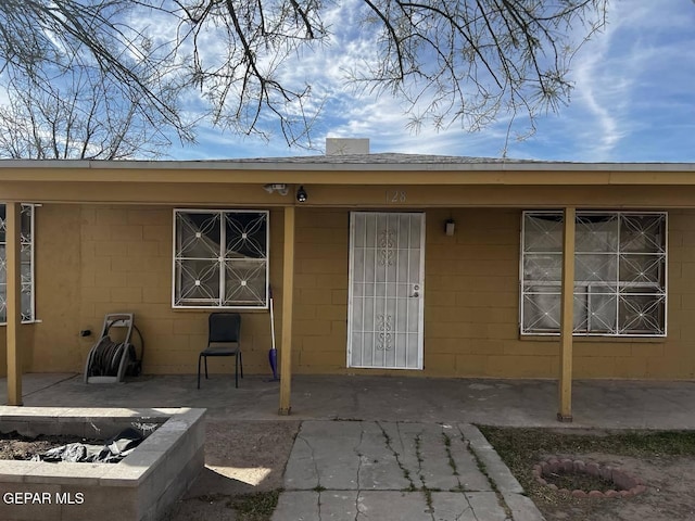 doorway to property with a patio area