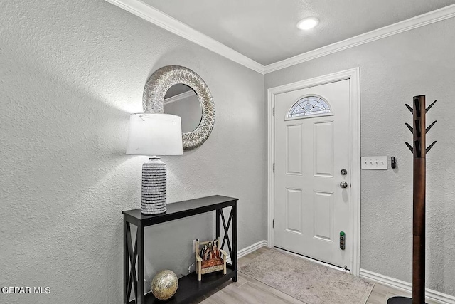 foyer entrance featuring ornamental molding