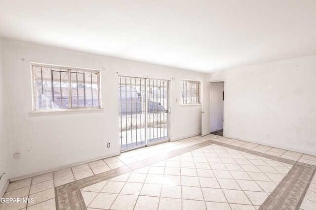 empty room featuring light tile patterned floors