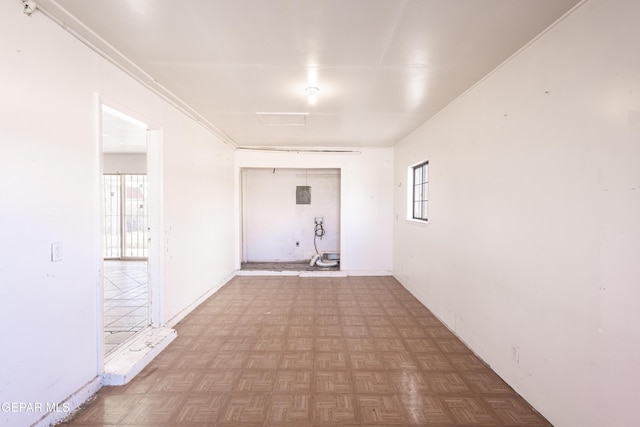 hallway featuring parquet flooring