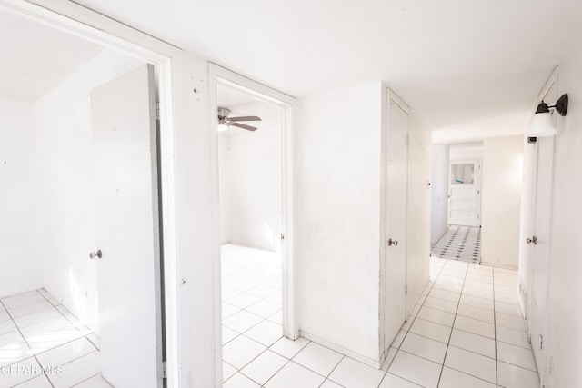 corridor featuring light tile patterned flooring