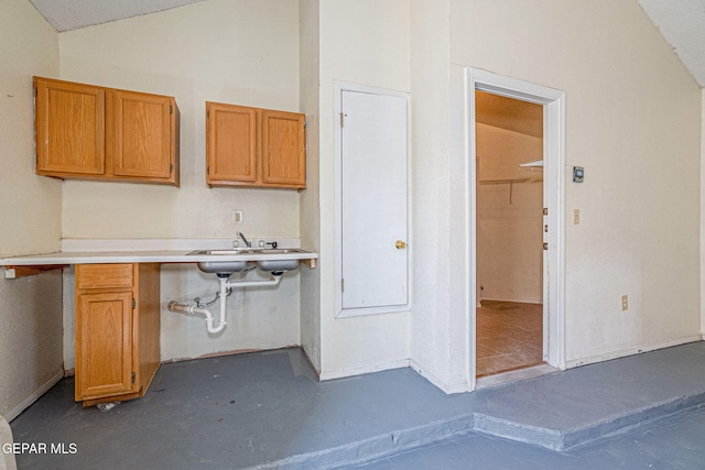 kitchen with sink and vaulted ceiling