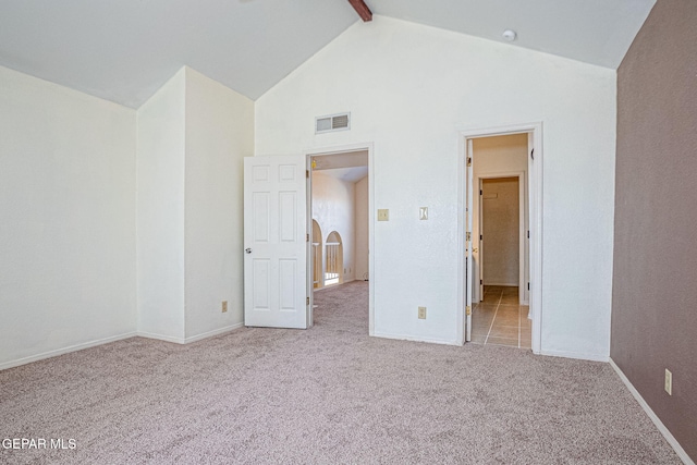 unfurnished bedroom with light carpet, high vaulted ceiling, and beamed ceiling