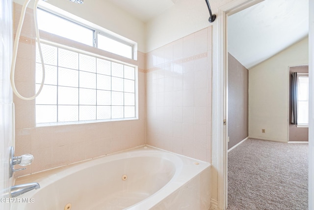 bathroom featuring vaulted ceiling