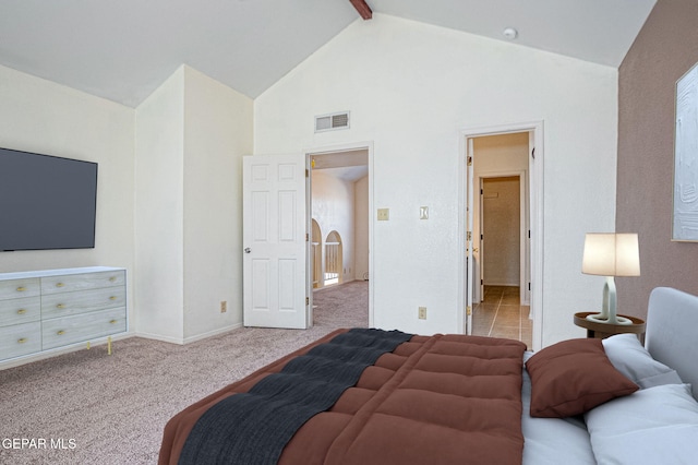 carpeted bedroom featuring beamed ceiling and high vaulted ceiling