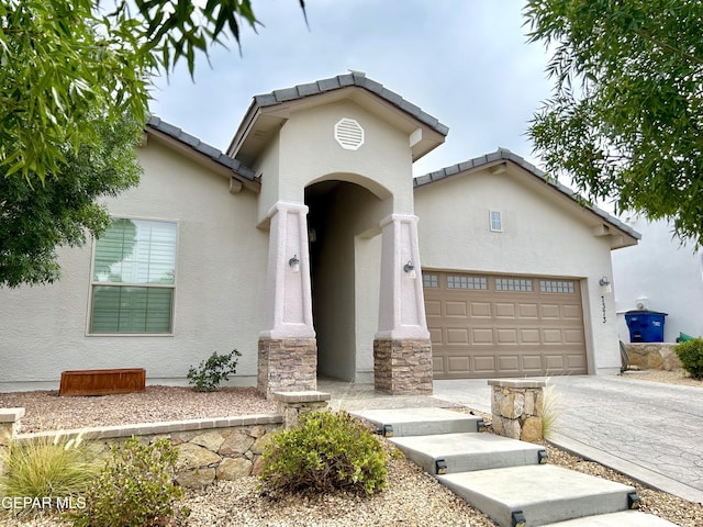 view of front of property with a garage