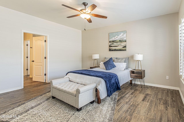 bedroom with dark hardwood / wood-style floors and ceiling fan