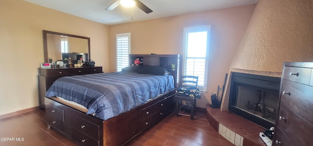 bedroom with dark wood-type flooring and ceiling fan