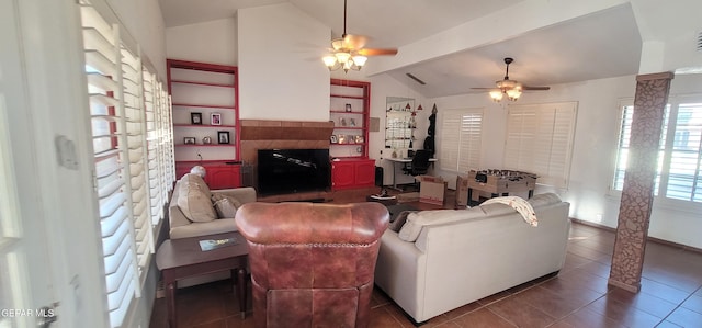 tiled living room with lofted ceiling with beams and ceiling fan