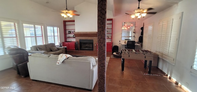 tiled living room featuring high vaulted ceiling and ceiling fan