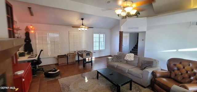 tiled living room featuring vaulted ceiling and ceiling fan