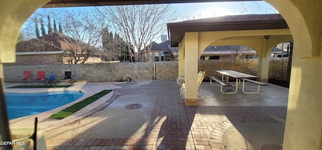 view of swimming pool featuring a patio area