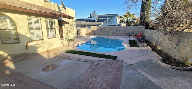 view of pool featuring a patio