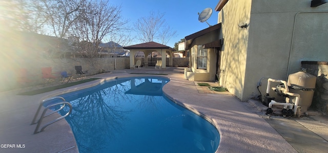 view of pool featuring a gazebo and a patio